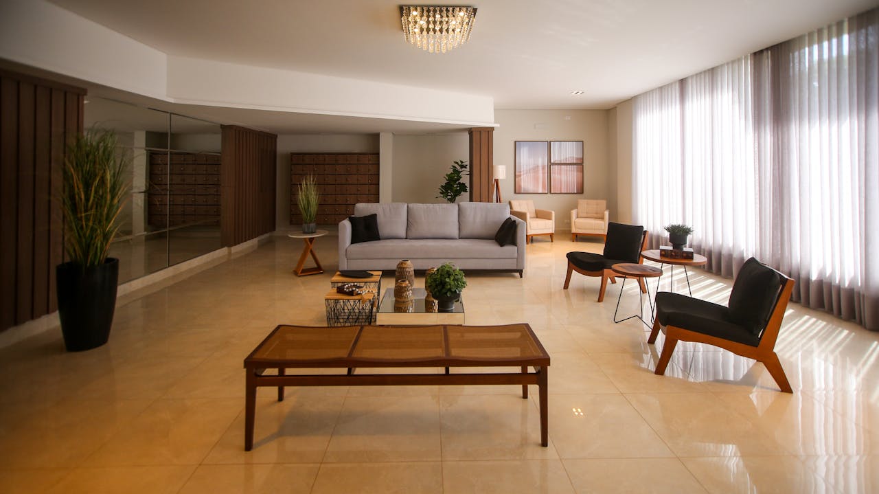 Elegant and spacious modern living room with luxurious furnishings and natural light.